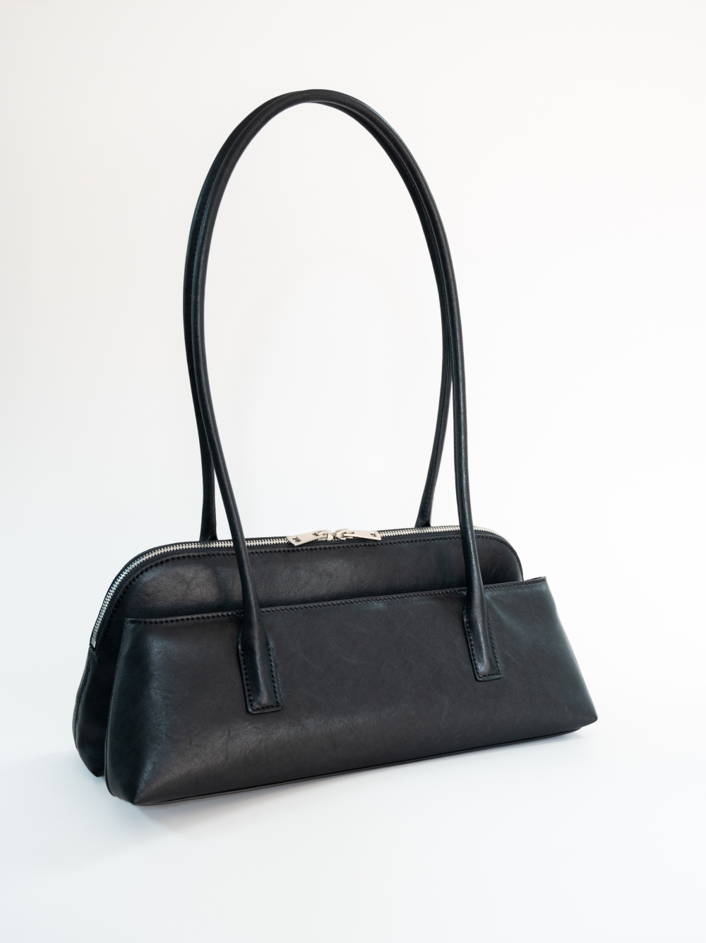 Ecologica ed elegante: la borsa in pelle melanina guida una nuova tendenza nel pendolarismo urbano con la sua 